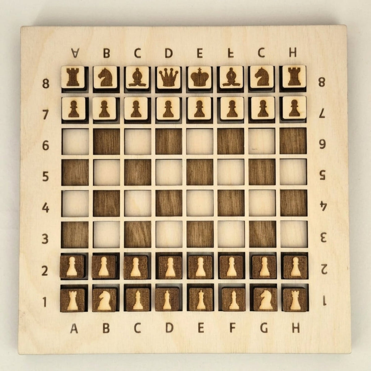 Chess side of the 3-in-1 wooden board game, engraved pieces set up in starting position — Skillberry